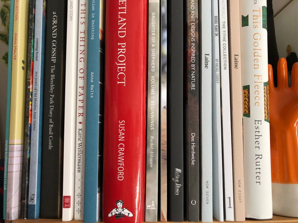 Photo of a packed bookcase.